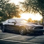 Car Dealership Lead Response Time: Why NZ Dealers Lose Sales 2 Car parked in a dealership lot at sunset, representing a car dealership working on lead response time