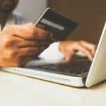 Customer entering card details at checkout on a laptop while shopping online