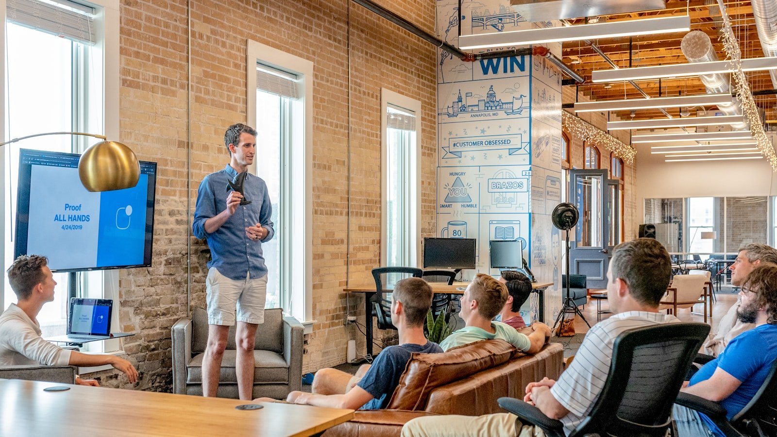 Small business team planning a LinkedIn content strategy around a whiteboard