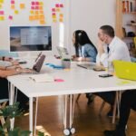 Social Media Crisis Management for NZ Small Business: Handling Negative Comments 2 Marketing team reviewing social media activity and comments together on laptops