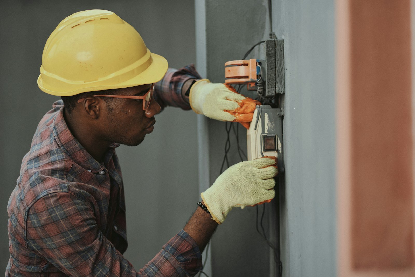 Electrician working on an electrical panel, representing tradie website design in Auckland