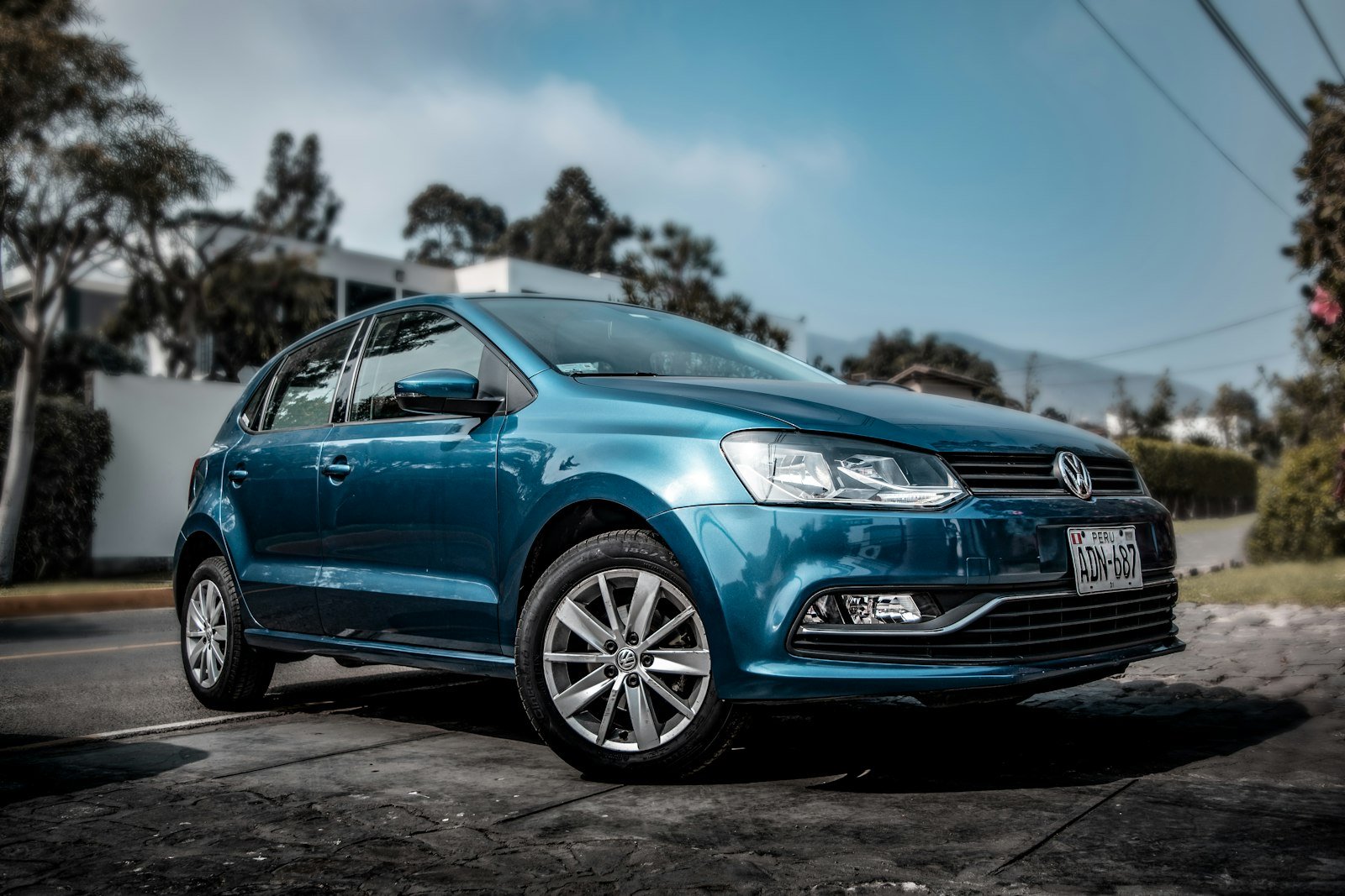 Car parked on a street, representing a vehicle a New Zealand owner may trade in through a dealer website valuation tool