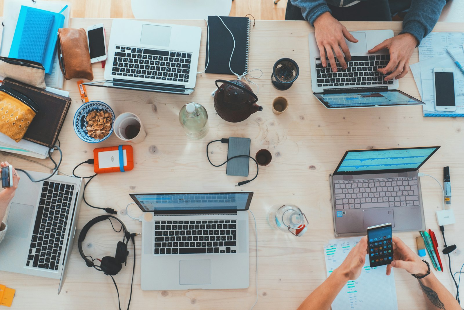 Person typing on a laptop while researching a domain name for their small business