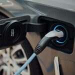 EV Marketing for NZ Car Dealers: What to Fix in 2026 3 Close-up of an electric vehicle charging cable plugged into a car, illustrating EV marketing for NZ car dealers