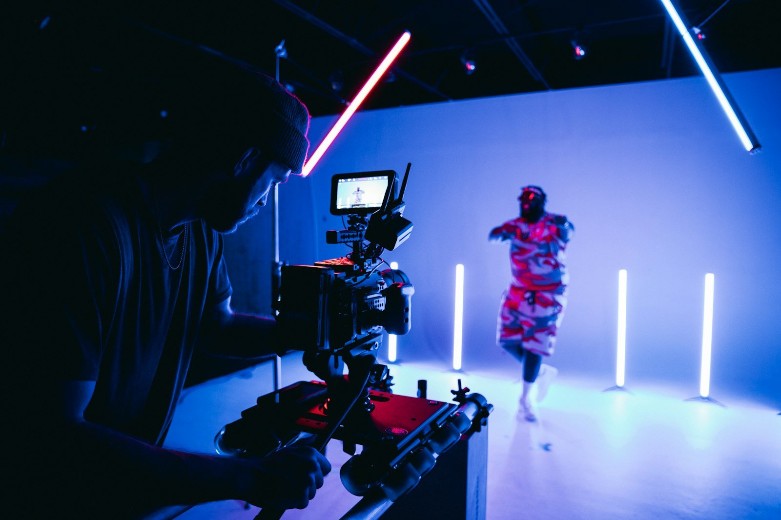 A videographer filming with a cinema camera in a studio, representing YouTube marketing for NZ small business