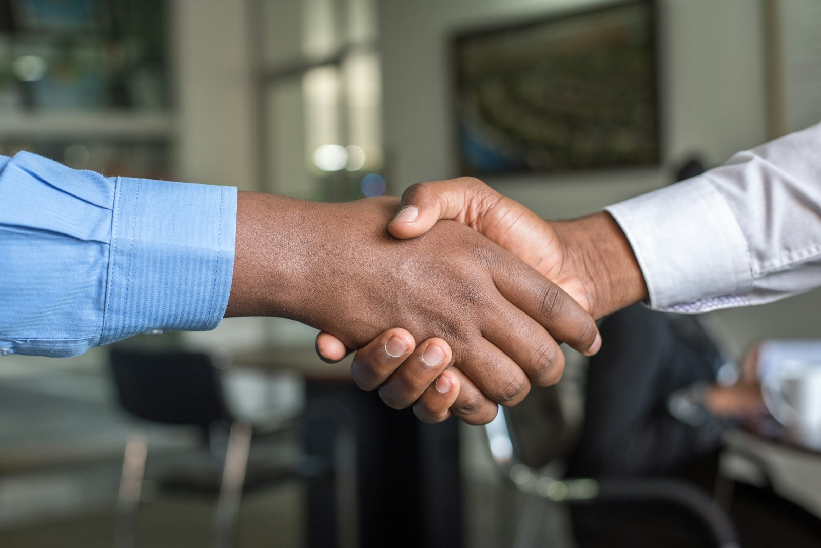 Business handshake representing a car dealership closing a sale after a fast lead response